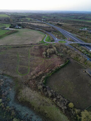 High Angle View of British Countryside and Village of Oxford Near M40 Motorways During Sunrise, England UK