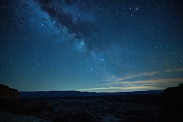 Landscape astrophotography with stars above scenic vistas, captures celestial beauty.