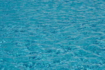 The texture of the water surface in the pool as a background.