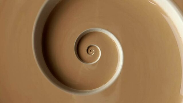 Animated cup of coffee or cocoa swirl frame. Abstract seamless swirl cup loop 4K border.  A cup with a drink twisted into an endless spiral. Backdrop for club, show, music video, presentation, office