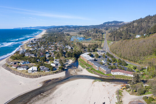 Aerial drone image of beautiful and empty beach of Neskowin, Oreogn, and the famous Proposal Rock, captured in 2020 during Covid-19 pandemic. Almost no people were enjoying spring sunshine that time