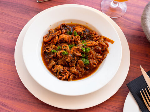 Pulpitos encebollados, traditional spanish onion soup with baby octopuses