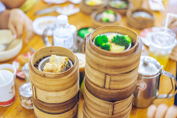 The background of food that is put in a wooden container (dim sum) containing vegetables, pork,...