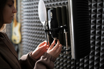 Musician Set Up plug in and adjust  Microphone in Soundproof Recording Studio - 766685153