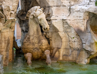 A horse sculpture in a Roman fountain, Italy