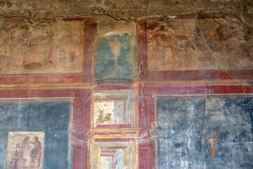 Beautiful ancient Roman frescos on a wall in Pompeii, Italy