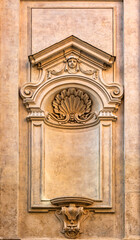 A beautiful wall frame outside a church in Rome, Italy