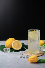 Refreshing lemonade drink or alcoholic cocktail with ice. Fresh healthy cold lemon beverage. Summer drink cocktail.