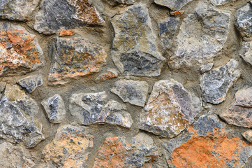 The wall is made of natural stone. Can be used as a background. 1