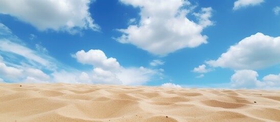 A serene close-up view of a sandy beach contrasting against a vivid blue sky - Powered by Adobe