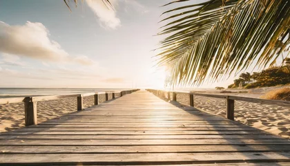 Poster wooden boardwalk on beach with sunny sky and palm leaves abstract travel background © Francesco