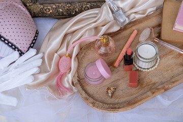 cosmetics, lipstick, perfume in spray bottle, women's underwear, retro style and elegance in...