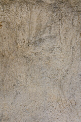 cracked concrete wall covered with gray cement texture as background