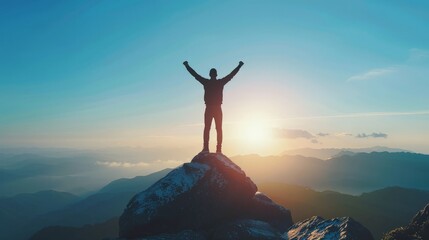 Silhouette of businessman celebrating raising arms on the top of mountain with over blue sky and sunlight. - obrazy, fototapety, plakaty