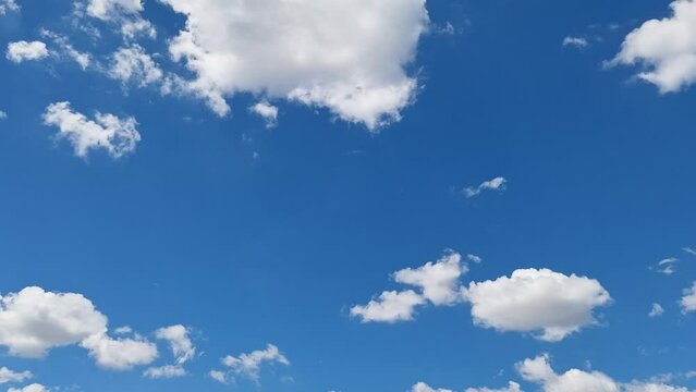 Time lapse motion background blue sky fluffy fluffy white clouds. Clouds and Blue Sky, Video quality, high definition, cumulus clouds and cirrus clouds. cumulus formation