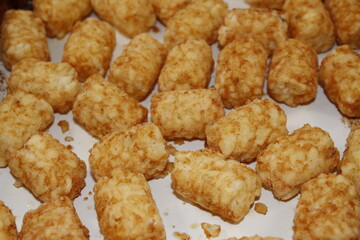 Brown Tater Tot's shot closeup in a pan,