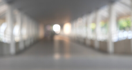 Blurred background bright shopping mall Silver gray lighting. defocused store light bokeh in retail...