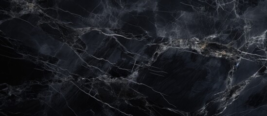 An up-close look at the detailed pattern of black marble on a smooth dark background - obrazy, fototapety, plakaty