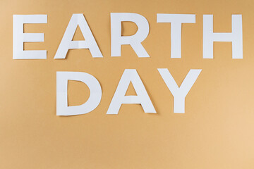 Earth Day Text on Beige Background, Concept of Environment World Earth Day, Copy Space