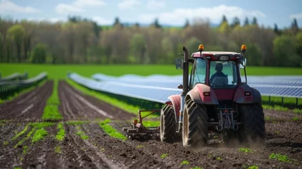 Rolgordijnen An electric tractor plowing the fields its battery charged by the solar panels showcasing the farms commitment to ecofriendly and . AI generation. © Justlight