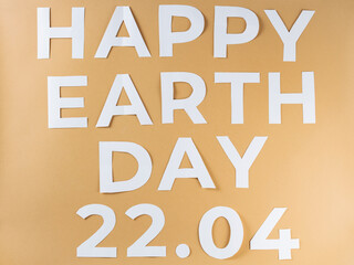 Happy Earth Day Inscription on Beige Background, Sustainability Concept