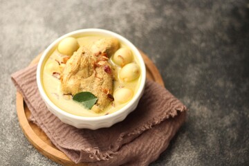 Chicken Curry Soup in White Bowl. Copy Space on dark background. 