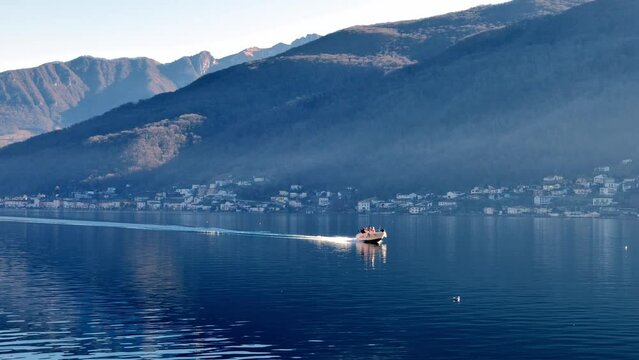 Boat Travel on Lake Lugano with Mountain in a Sunny Day with Clear Sky in Morcote, Ticino, Switzerland, Europe