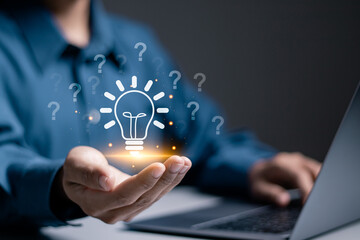 Question mark concept. Problem and solution. Quiz, test, survey, support, knowledge, decision. Businessman holding light bulb with question mark icon on virtual screen for FAQ. - obrazy, fototapety, plakaty