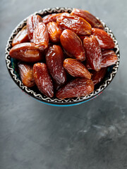 Medjool Dates Bowl on Dark Concrete, Healthy Ramadan Suhour Snack, Copy Space