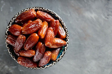 Medjool Dates Bowl on Dark Concrete, Healthy Ramadan Suhour Snack, Copy Space