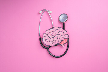 Stethoscope with human brain cutout paper. Health or pathological condition of human brain,...