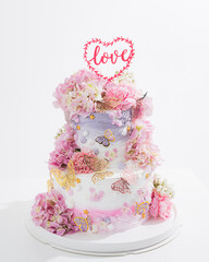 pink wedding cake with decoration with pink flower and cream on white,Food and flower wedding concept. - 766751936