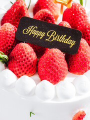 Delicious birthday cake with fresh strawberries, on wooden table and white background. Free space for your text. - 766753965