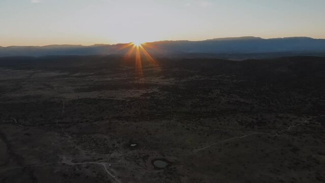 Sun Shining Over Barren Land During Sunset. - aeial shot