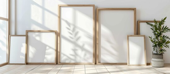 Wooden frame mockup of various sizes displayed on a white wall, suitable for showcasing posters in...