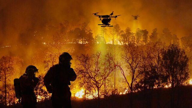 Firefighting drones spray chemical to help control wildfires.