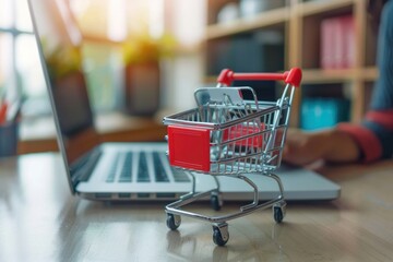 card box small in shopping cart with businesswomen using laptop on a desk, e-commerce, and delivery online business concept.