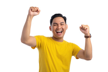 Excited handsome Asian man doing winner gesture with arms raised, shouting, celebrating success...