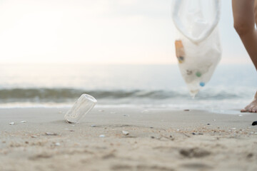 Save water. Volunteer pick up trash garbage at the beach and plastic bottles are difficult decompose prevent harm aquatic life. Earth, Environment, Greening planet, reduce global warming, Save world