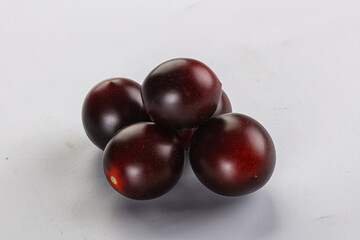 Raw ripe black kumato tomato