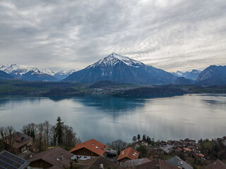 Aeiral image of Niesen mountain, also called as Swiss Pyramid with reflection on the Thun lake