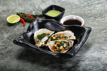 Open half oysters with green onion