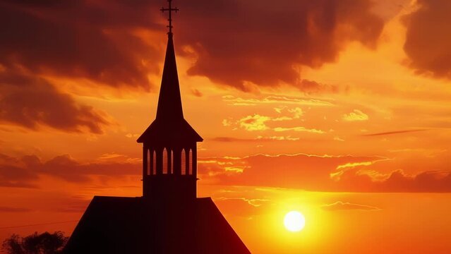 A rural church steeple rises against the fiery hues of a sunset its silhouette a symbol of faith in the tranquil countryside.