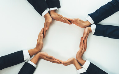 Business people collaborate business synergy and cooperation, join hand as frame around empty blank...