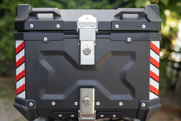 The motorcycle luggage bag is attached to the rear.