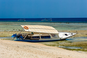 Wooden boats on the beach of a small tropical island (Gili Air, Indonesia)