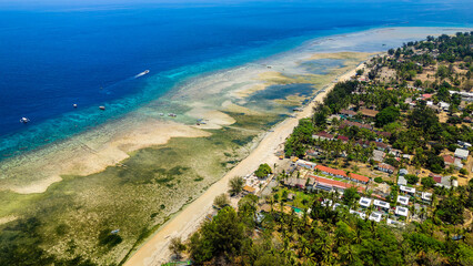 Aerial view of the fringing coral reef surrounding the small island of Gili Air in Lombok, Indonesia