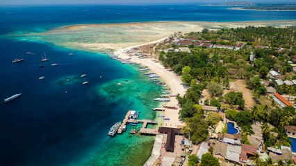 Aerial view of the harbor, port and boats of the tiny tourist island of Gili Air off the island of Lombok