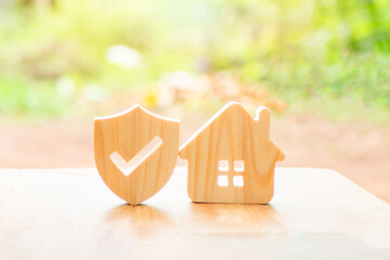 Percentage and house sign symbol icon wooden on table. Concepts of home interest, real estate, investing in inflation.	