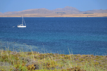 seascape with coast and boat - Fanaraki area, near Moudros, Lemnos, Aegean Sea, Greece